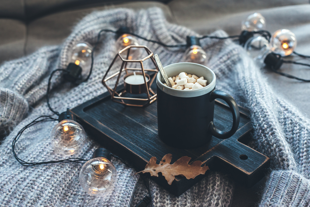 Cup on wooden chopping board